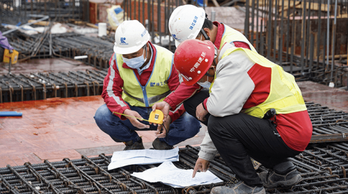 A site supervision team inspects and a the tying of rebars.