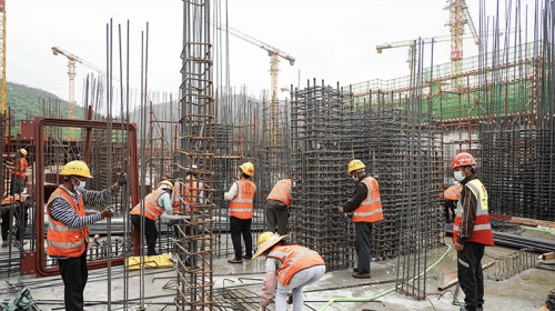 Workers carry out basement constructions.